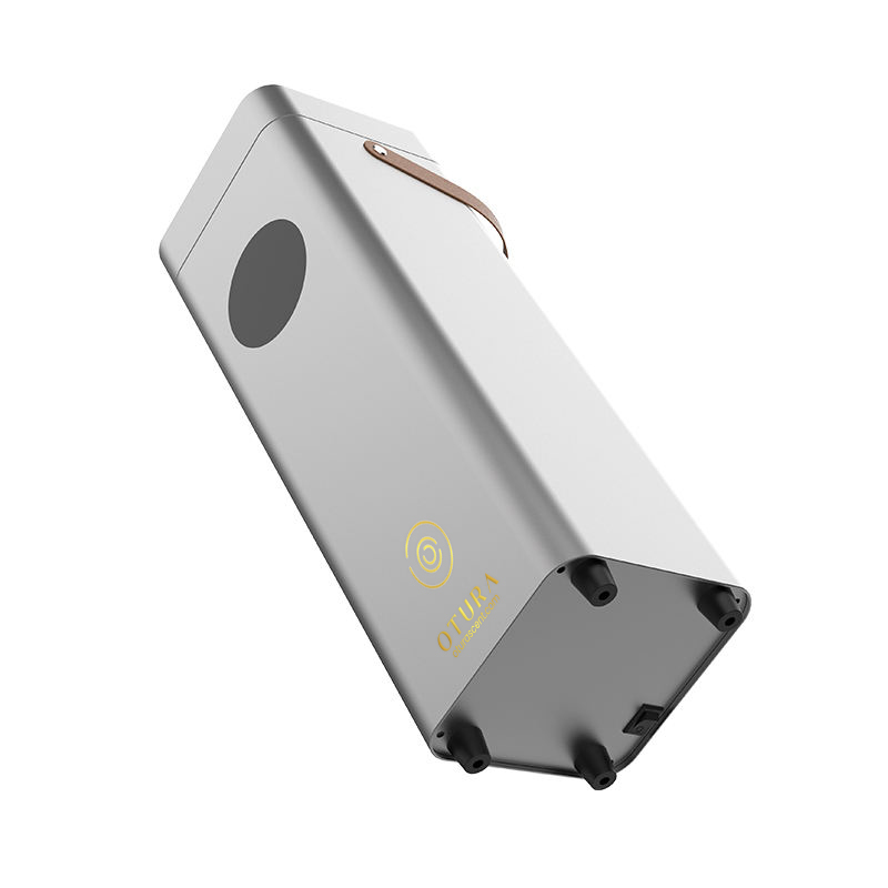 Bottom angle view of the OTURA ELITE scent machine showing gold branding and professional grade housing.