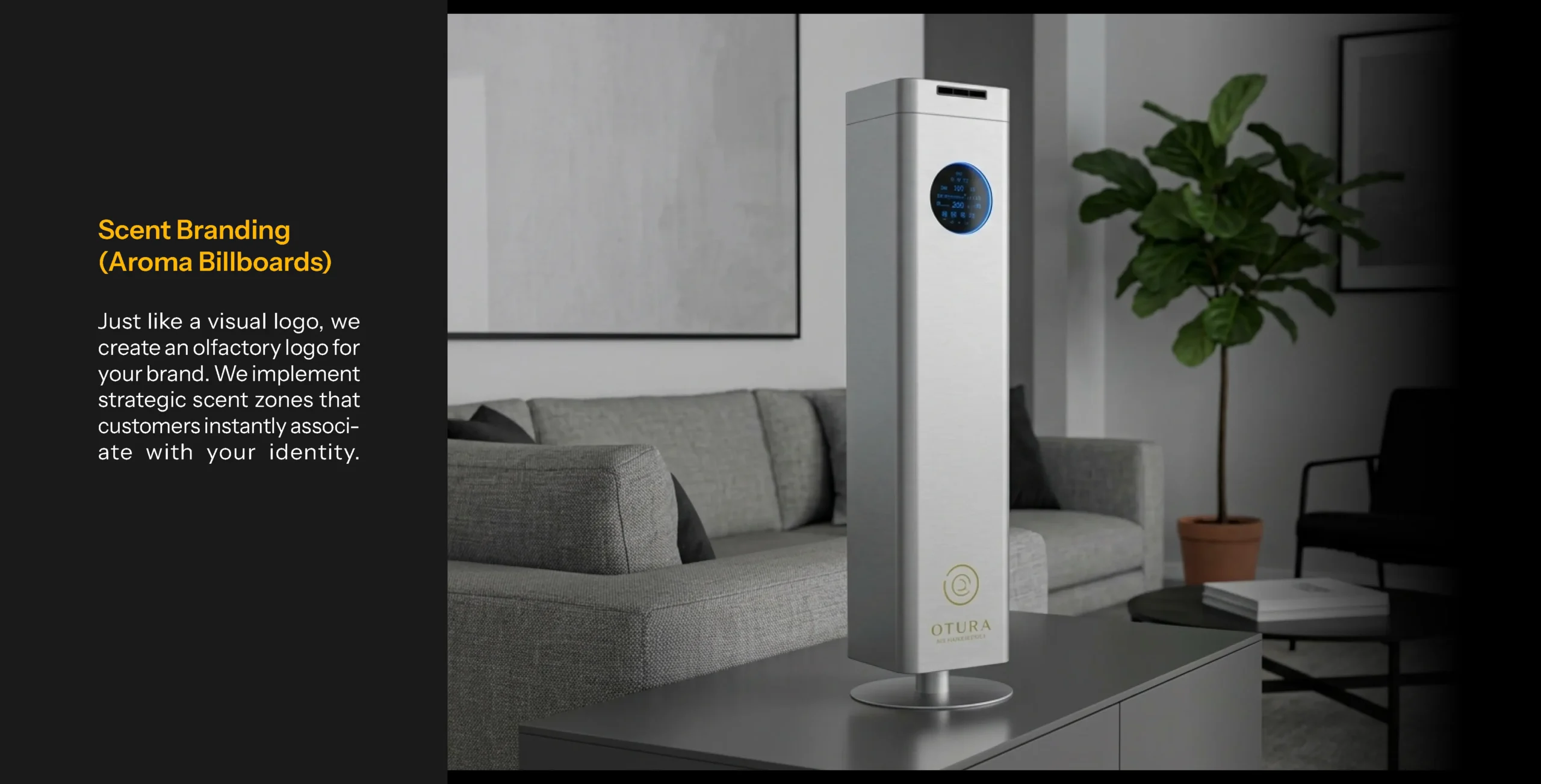A silver Otura tower scent diffuser placed in a modern, minimalist grey lounge, representing ambient scent branding and olfactory logos.